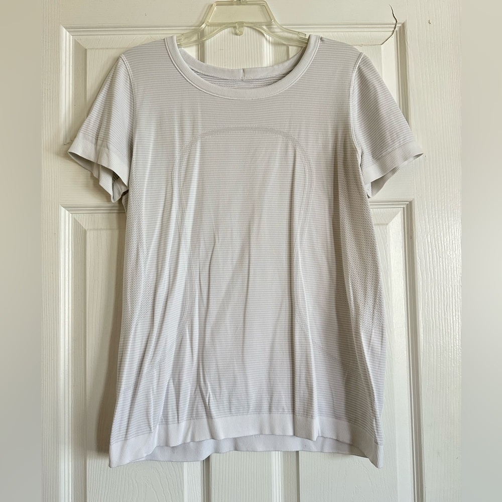Women’s Swiftly Tech Short Sleeved Shirt. Great condition. White, size 10.